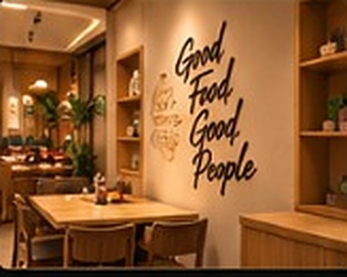 A cosy corner with 'Good Food, Good People' lettering on the wall
